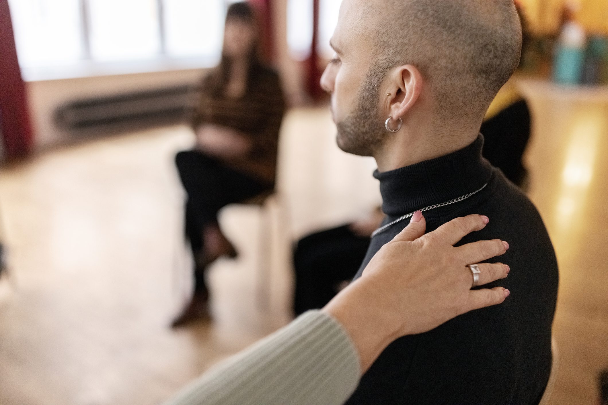 Emotional man sharing his story during a support session.